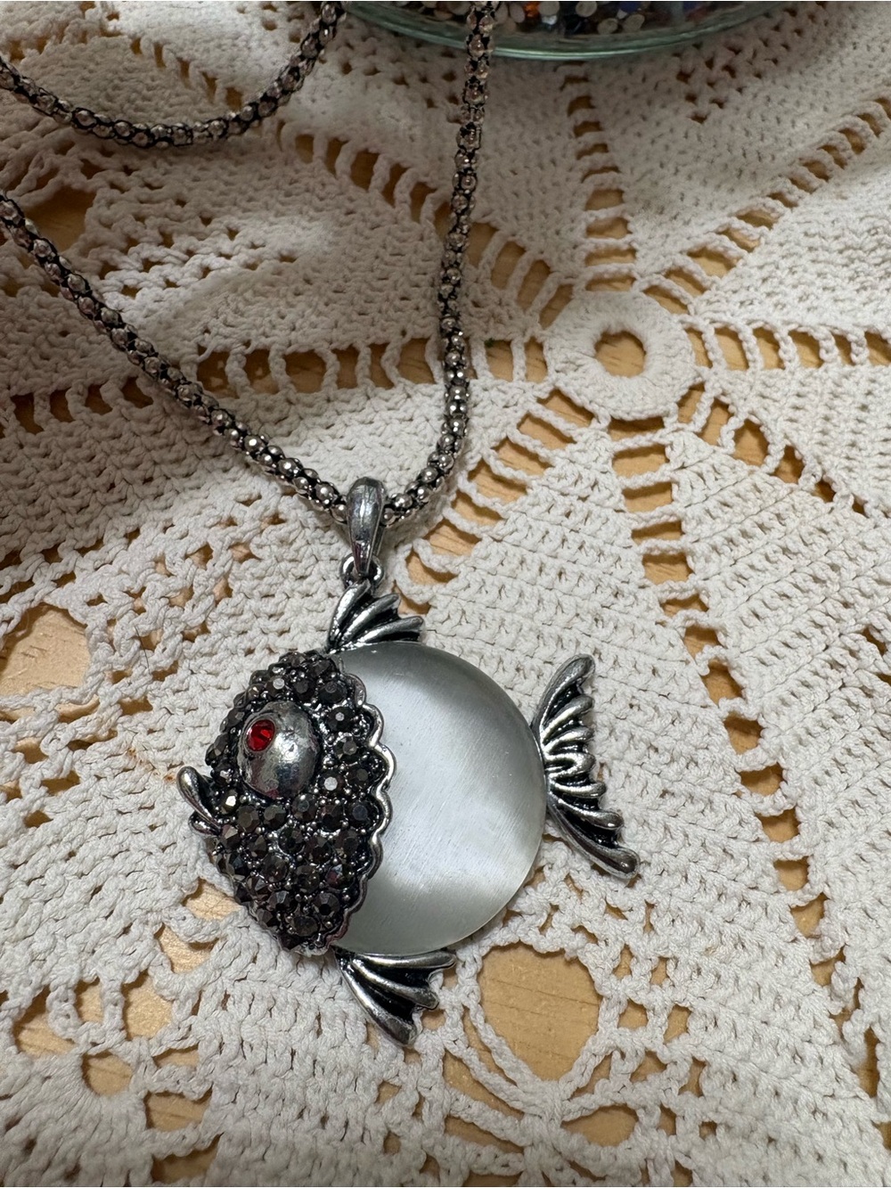 Ruby Eye Silver Tone Fish Pendant Necklace with Satin Disc and Marcasite Face